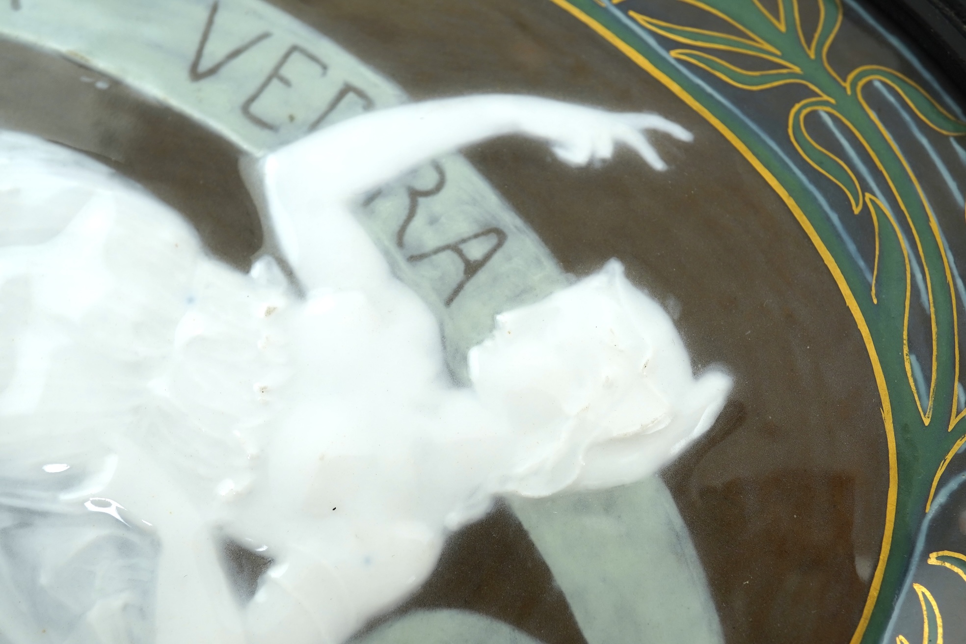 A late 19th century English pate sur pate oval porcelain plaque in the style of Louis Solon